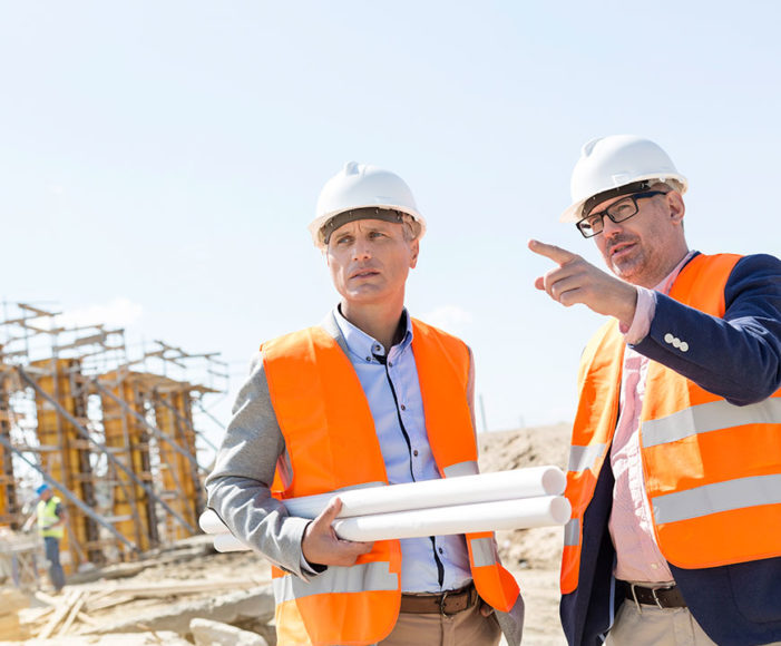 Two construction workers working on a job with Commercial Insurance in Grover Beach, California 