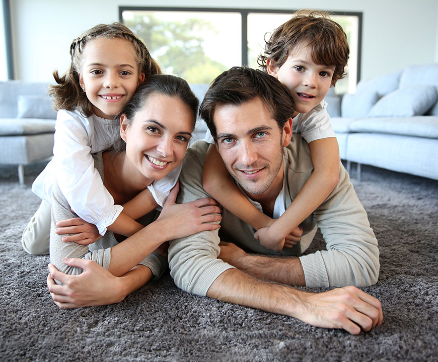 a man and woman with two kids with Homeowners Insurance in Santa Maria, Paso Robles, Arroyo Grande, San Luis Obispo, Nipomo, Pismo Beach